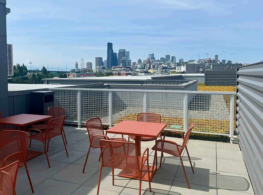 Rooftop deck with a view of Seattle from 900 Rainier Apartment's building
