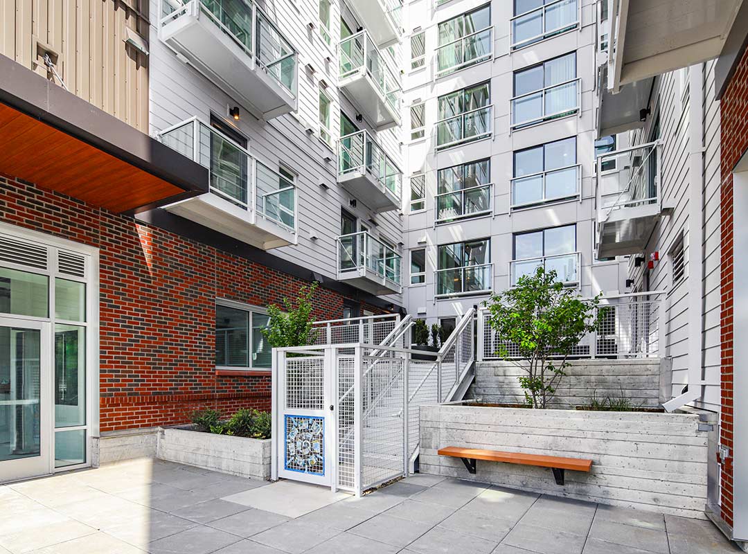 15 Ground level entry of 900 Rainer's apartment homes